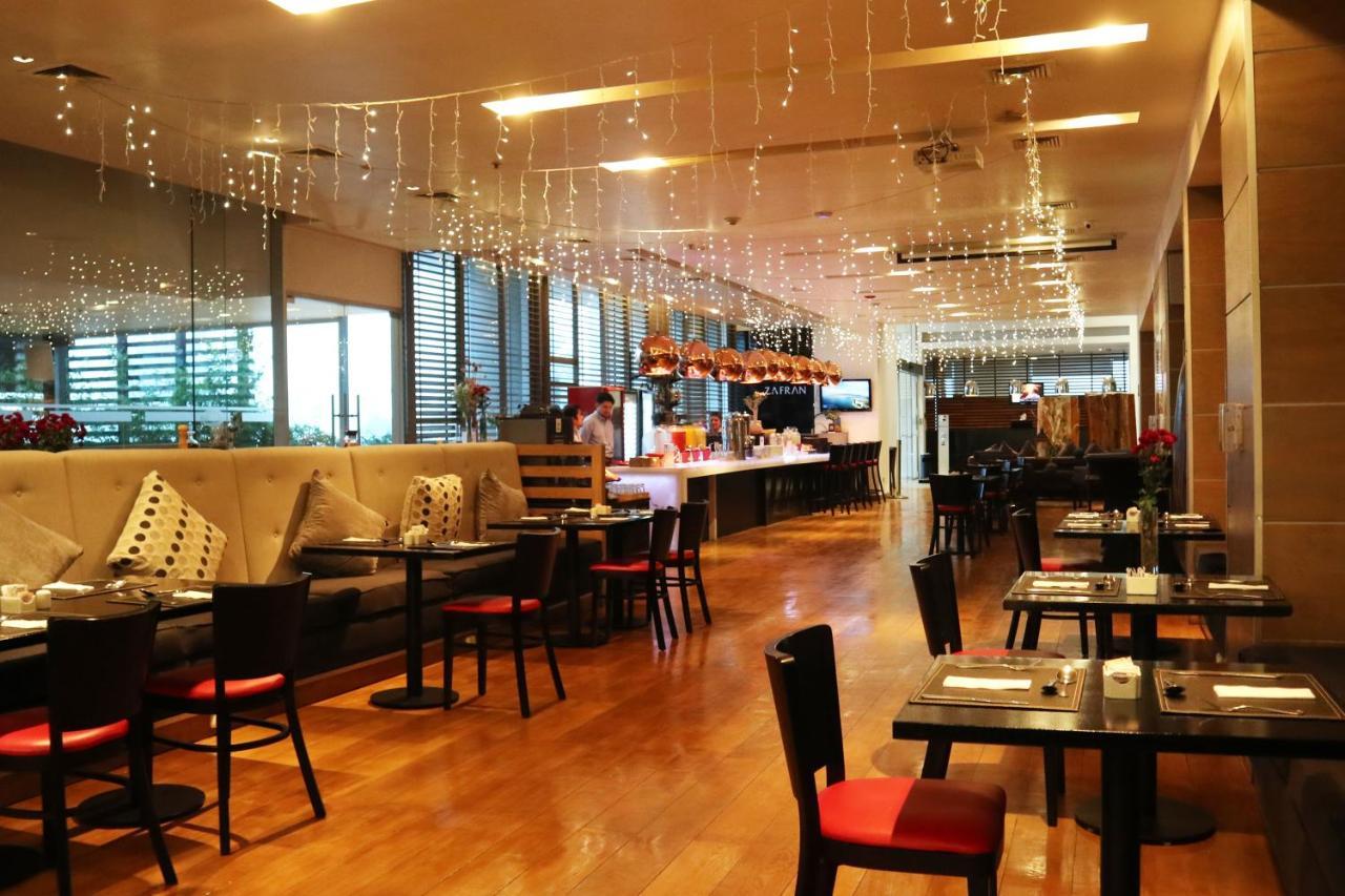 Wyndham Concepcion Pettra Otel Dış mekan fotoğraf The interior of the restaurant